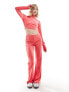 Фото #1 товара adidas Originals velvet flared trousers in bright pink