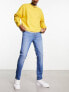 ASOS DESIGN skinny jeans in mid wash blue