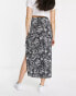 ASOS DESIGN bow detail midi skirt with thigh split in mono smudge print