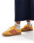 adidas Originals Handball Spezial trainers in yellow and pink with gum sole