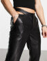 ASOS DESIGN bootcut trousers in leather look with cut out sides in black - BLACK