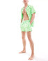 ASOS DESIGN swim shorts in short length in green print