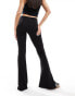 Фото #2 товара Bershka high waisted jersey flared trousers in black