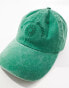 ASOS DESIGN washed slogan cap in green