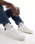 Levi's Swift trainers with logo in white and navy