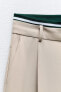 Full-length trousers with band detail