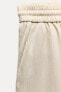 CREASED-EFFECT WIDE-LEG TROUSERS