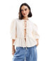 ASOS DESIGN textured peplum tie shirt top in ivory