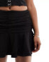 Extro & Vert flippy mini skirt in black