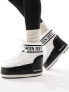 Moon Boot mid ankle snow boots in black and white