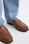 Leather loafers with appliqué