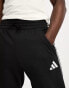 Фото #4 товара adidas Football Tiro tracksuit joggers in black