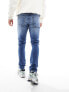 ASOS DESIGN skinny jeans in mid wash blue