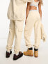 Фото #2 товара Calvin Klein Jeans unisex cargo joggers in beige - exclusive to ASOS