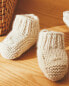 Knitted booties with floral detail