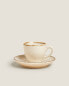 Porcelain coffee cup with antique finish rim