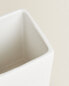 White earthenware toothbrush holder