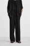 CREASED-EFFECT KNIT TROUSERS