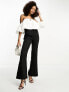 Фото #4 товара In The Style bardot puff sleeve flared jumpsuit in black and white