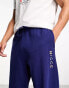 Nicce split logo jersey joggers in navy