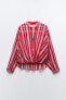 Striped semi-sheer shirt with knot