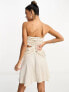 ASOS DESIGN satin bandeau drape twist mini dress with cut out detail in gold