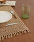 Fibre placemat with fringing