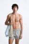 Check-texture swimming trunks