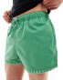 ASOS DESIGN swim short in short length in green with hem detail