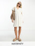Фото #1 товара Mamalicious Maternity brodiere mini dress with frill sleeve in white