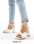 Фото #1 товара ASOS DESIGN Wide Fit Hitched bow detail mid block heeled sandals in ivory