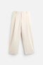 RELAXED FIT PLEATED TROUSERS