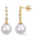 Фото #1 товара South Sea Cultured Pearl (10-10.5mm) and Diamond (1/6 ct. t.w.) Dangle Earrings in 14k Yellow Gold