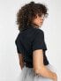 Nike Essential mini swoosh short sleeve polo top in black