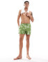 ASOS DESIGN swim shorts in short length in green floral print