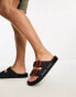 Karl Kani street sliders in black with red buckles