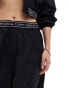 Фото #4 товара Tommy Jeans baggy taping trackpants in black