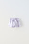 Plush bermuda shorts with bow and ruffles