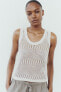 Sleeveless metallic thread knit top