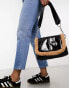 Urbancode patent shoulder bag with borg trim in black