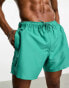 ASOS DESIGN swim shorts in short length in turquoise