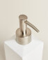 White earthenware bathroom soap dispenser