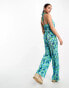 Monki jersey plisse cross back detail jumpsuit in blue and green flower print