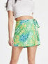 Фото #1 товара ASOS DESIGN wrap tie skort in green meadow floral print