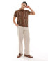 ASOS DESIGN polo in brown and beige wavy stripe